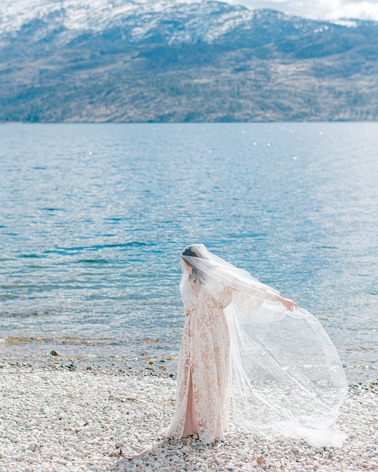 Bride wearing Julia gown by Anna Kova, intimate Okanagan bridal portraits, lakeside and mountain elopement inspiration