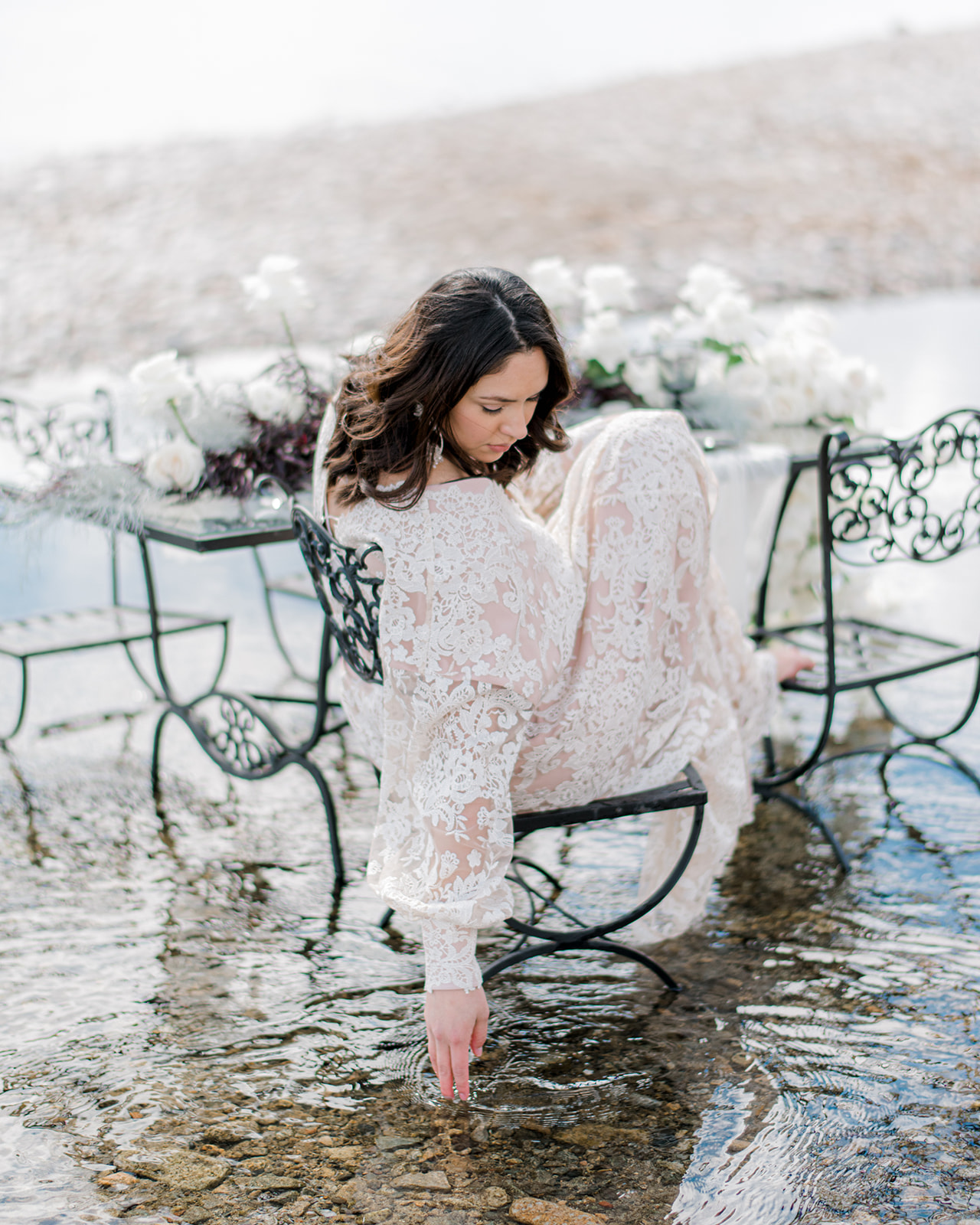 Bride wearing Julia gown by Anna Kova, intimate Okanagan bridal portraits, lakeside and mountain elopement inspiration. Stunning bridal portrait in an ethereal bridal editorial on Lake Okanagan, BC, featured on Brontë Bride.