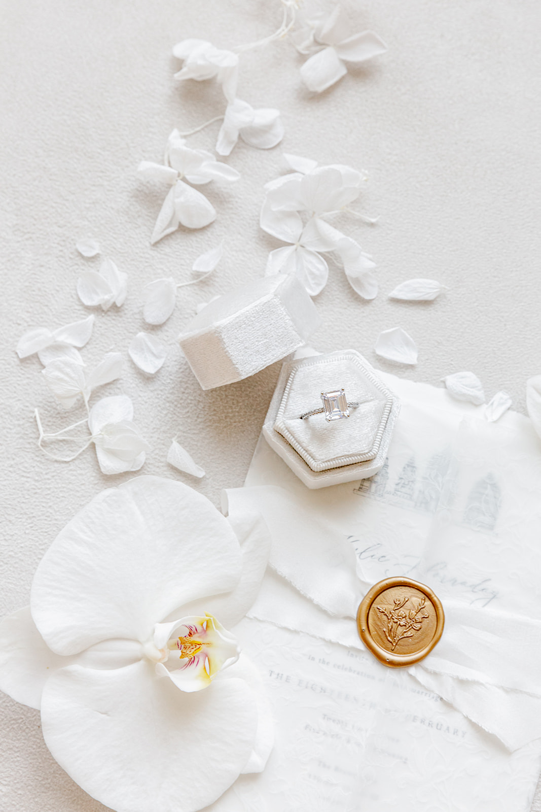 Clean and sophisticated white and cream wedding details captured by Revel Photography & Films. Invitation paper suite custom designed by Pink Umbrella Invites. 
