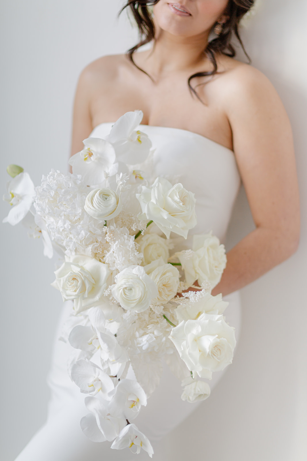 Sophisticated white bridal floral bouquet designed by Hen & Chicks in Calgary, Alberta. 
