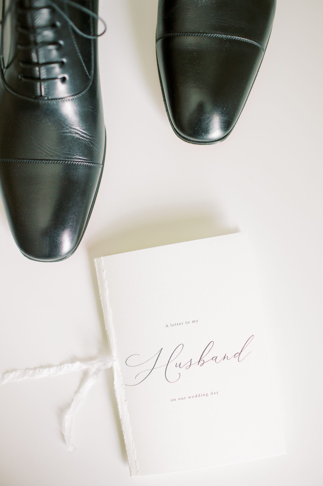 Classy portrait of groom details featuring a beautiful and elegant letter to your husband on your wedding day. 