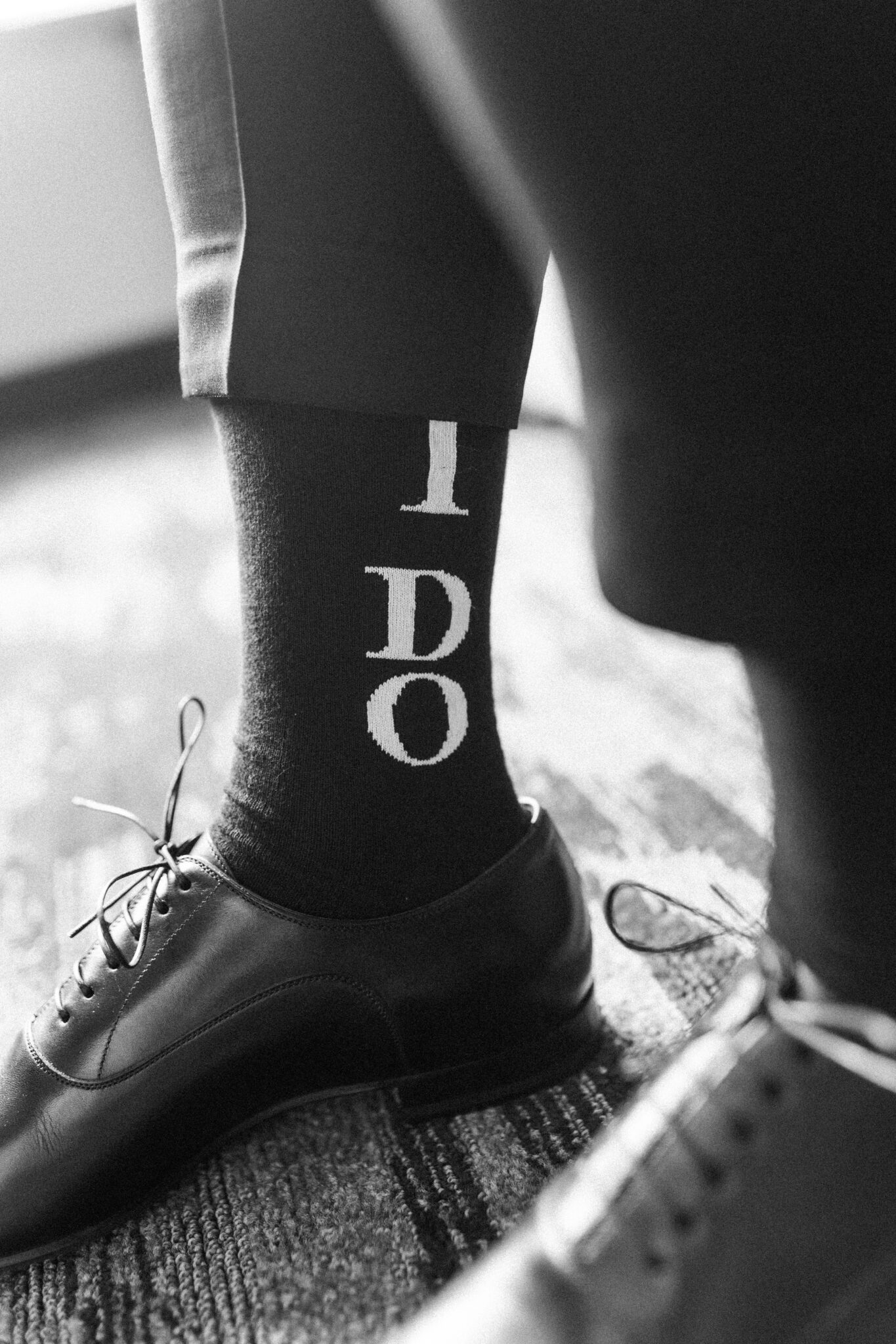 Groom getting ready on his wedding day at Sparrowlane Events featuring "I Do" socks. Elegant wedding inspiration. 