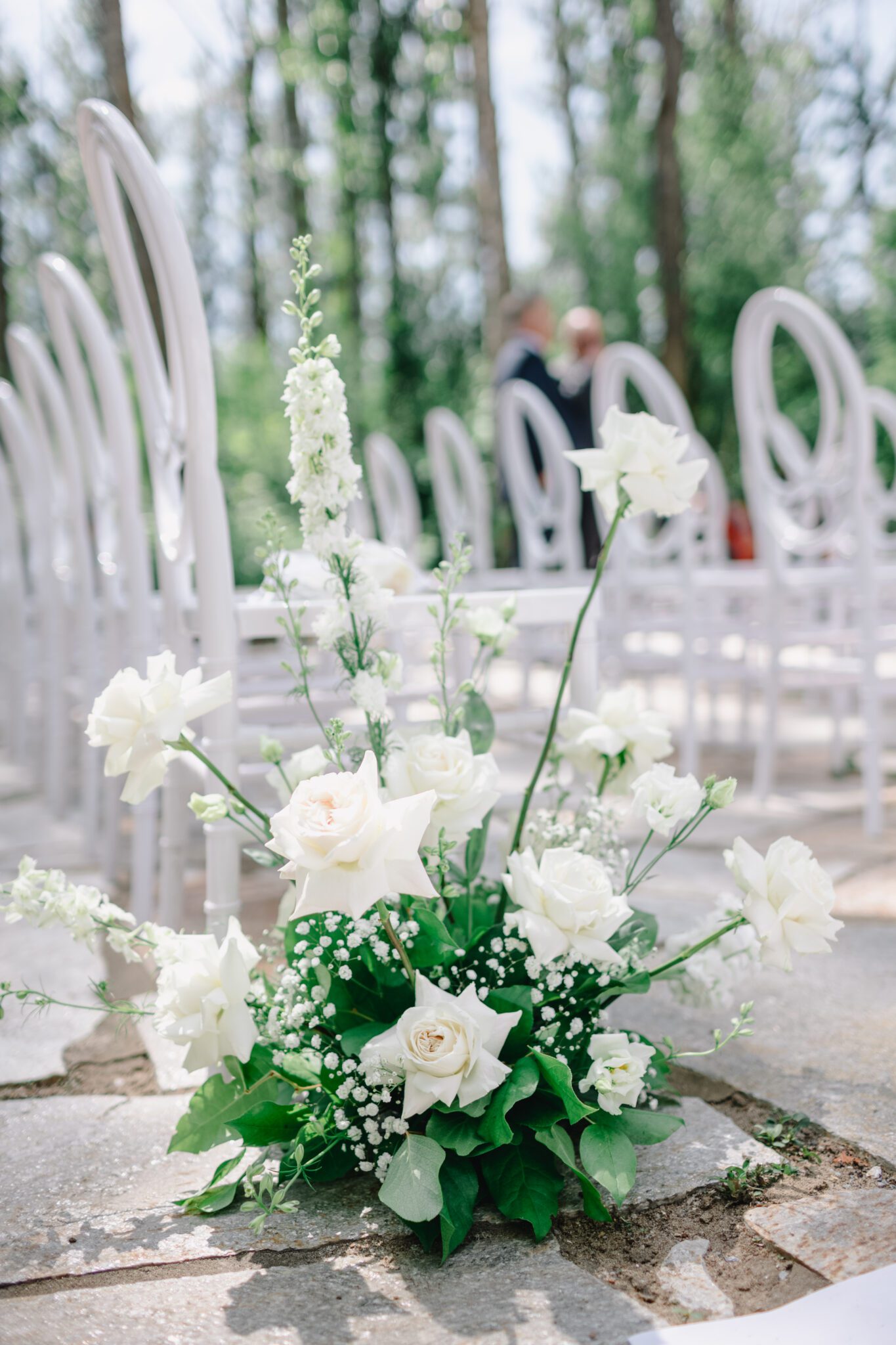 Elegant white rose aisle florals by Lovella Lifestyle. Classic colour palette of white, blush, and green wedding inspiration. 
