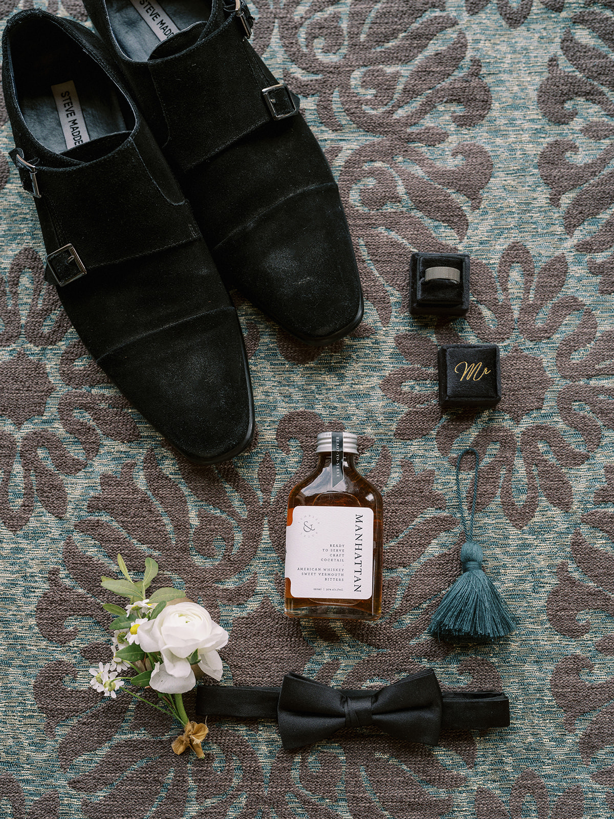 Elegant groom details featuring black velvet shoes, “Mr” ring box and custom Manhattan cocktail captured by Justine Milton.
