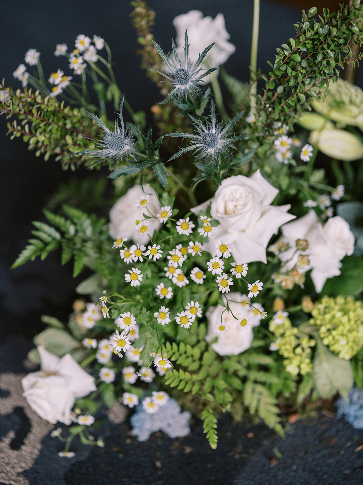 Stunning organic florals in an oceanic colour palette by Hue Florals. Mediterranean-Inspired wedding at The Malcolm Hotel in Canmore, Alberta. 
