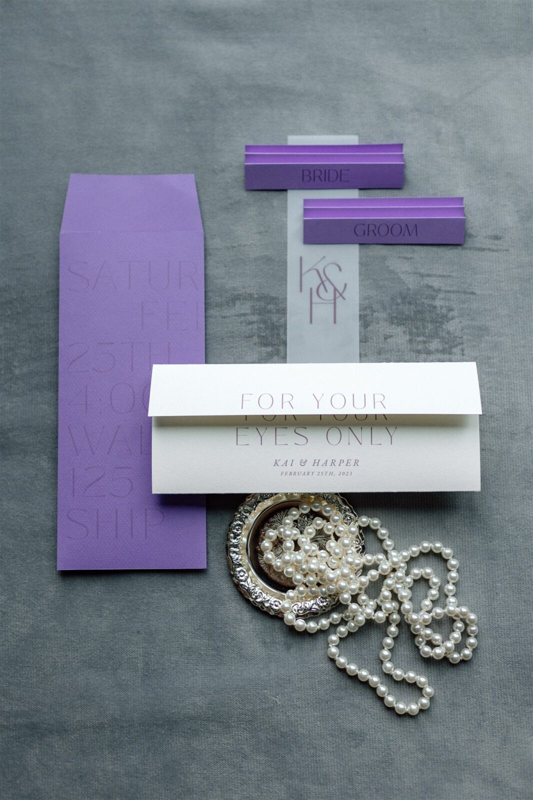 Elegant plum and white wedding invitation designed by Jrnl Studio.