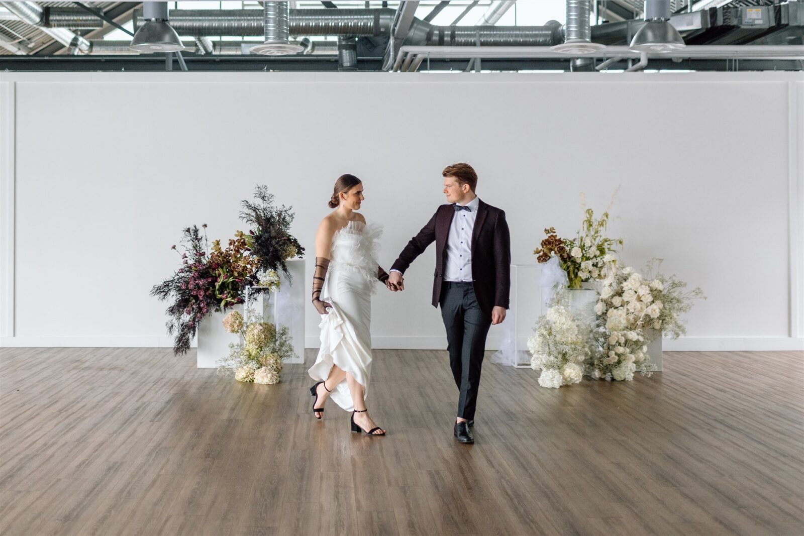 Couple dancing at sophisticated and minimalist wedding at The Wallace Venue in Vancouver, BC. Chic wedding inspiration, designed by Rebekah Brontë Designs.