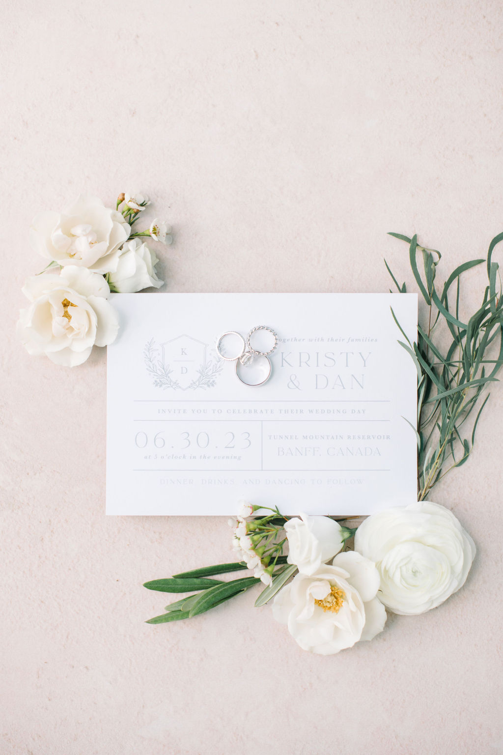 Elegant white wedding invitation paper suite styled with white roses and greenery, Classic neutral, blush, cremes colour scheme, photographed by Corrina Walker Photography. 