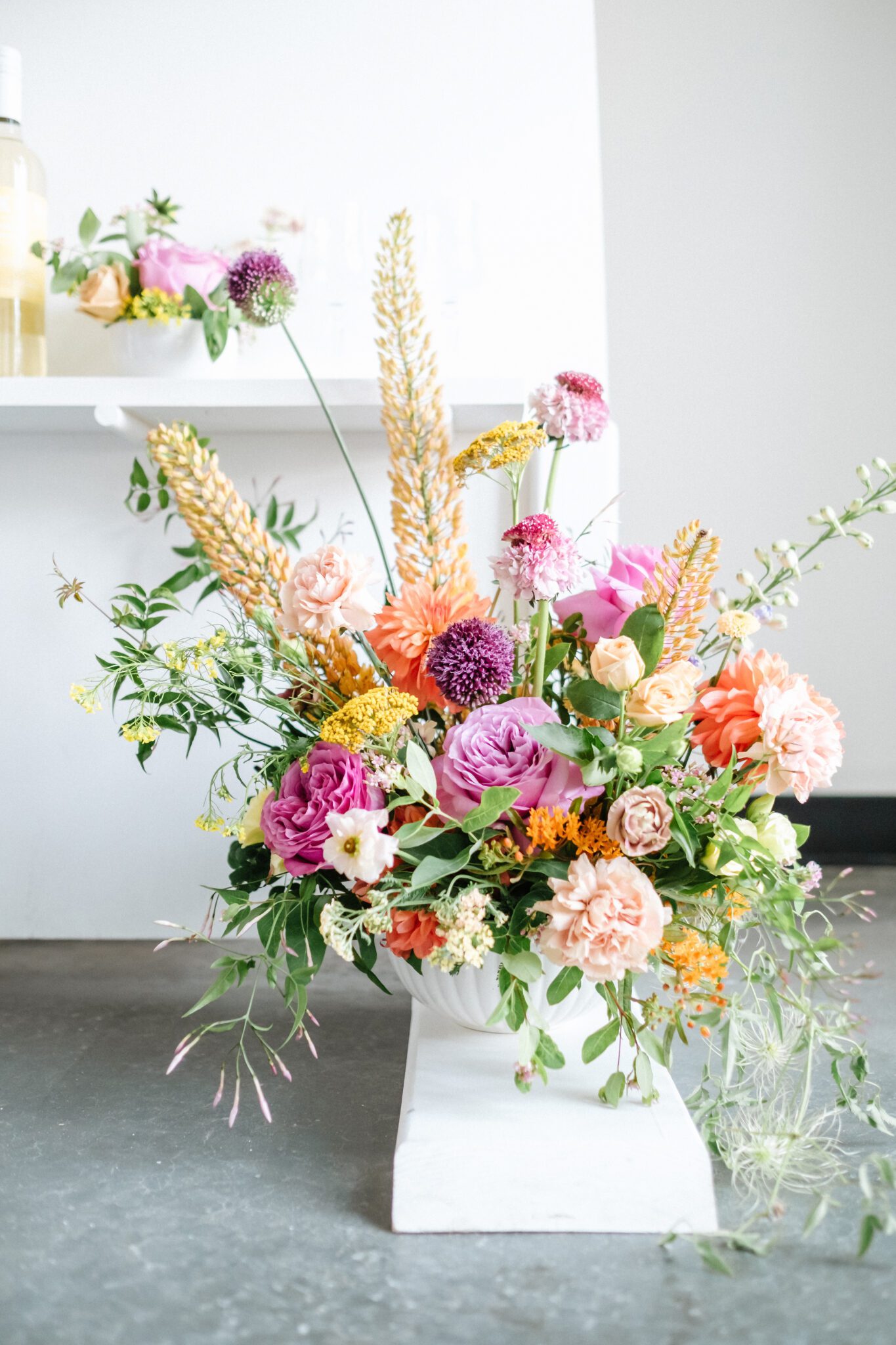 Bright & colourful wedding florals by Meadow & Vine. Retro-inspired vibrant colour palette of purple, orange, yellow, peach, tangerine and coral.