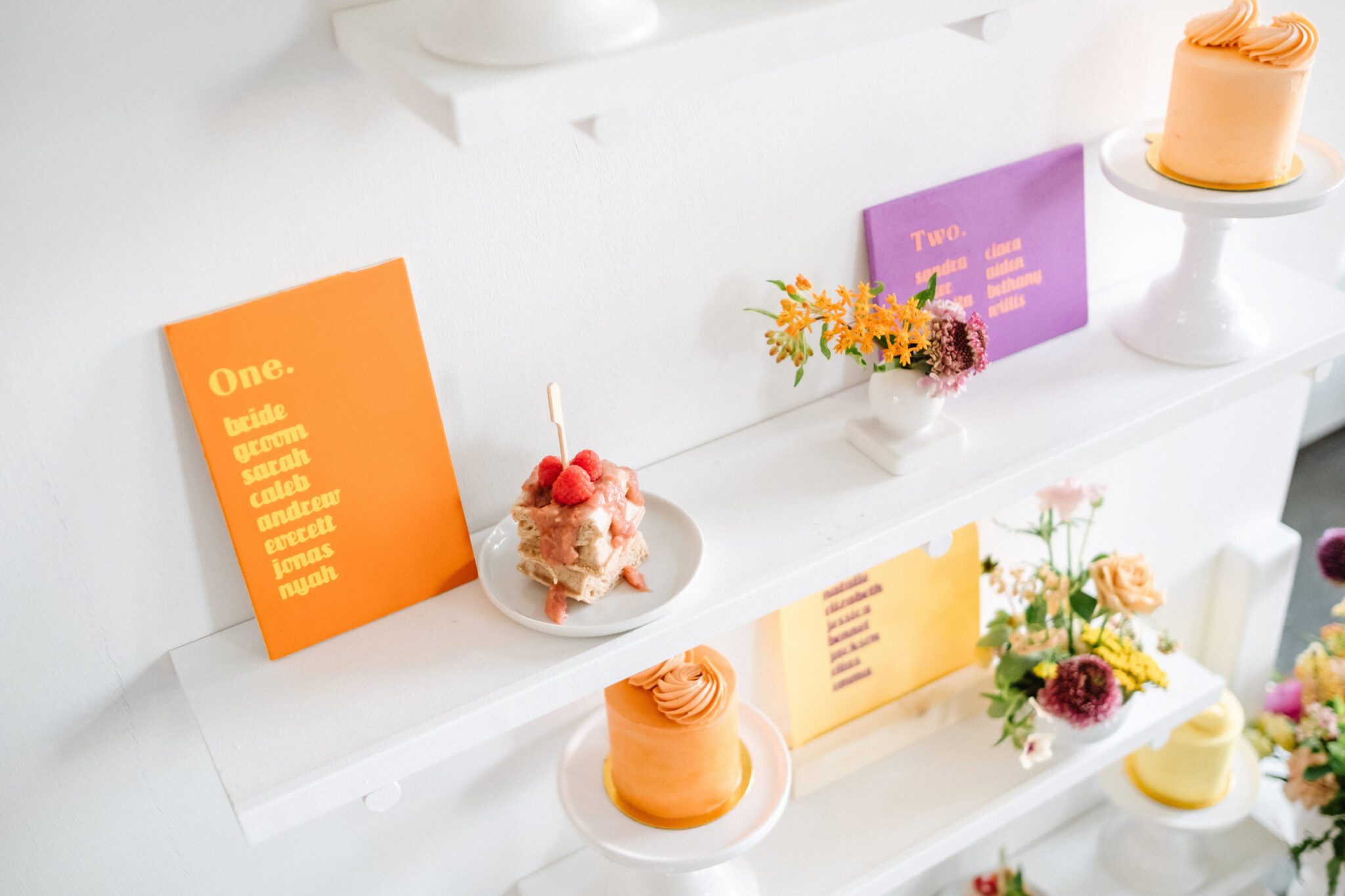 Bright and colourful wedding at The Brownstone Calgary, brunch wedding inspiration that combines mod style with retro decor. Tangerine, peach, purple and yellow colour scheme. Custom cocktails, retro inspired signage and custom mini wedding cakes.  