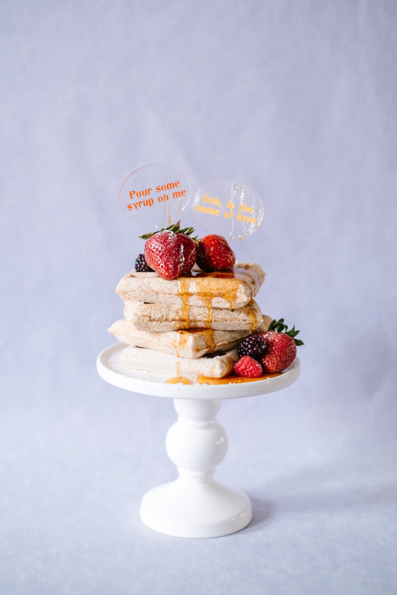 Bright and colourful wedding at The Brownstone Calgary, brunch wedding inspiration that combines mod style with retro decor. Tangerine and purple colour scheme menu featuring waffles and berries.
