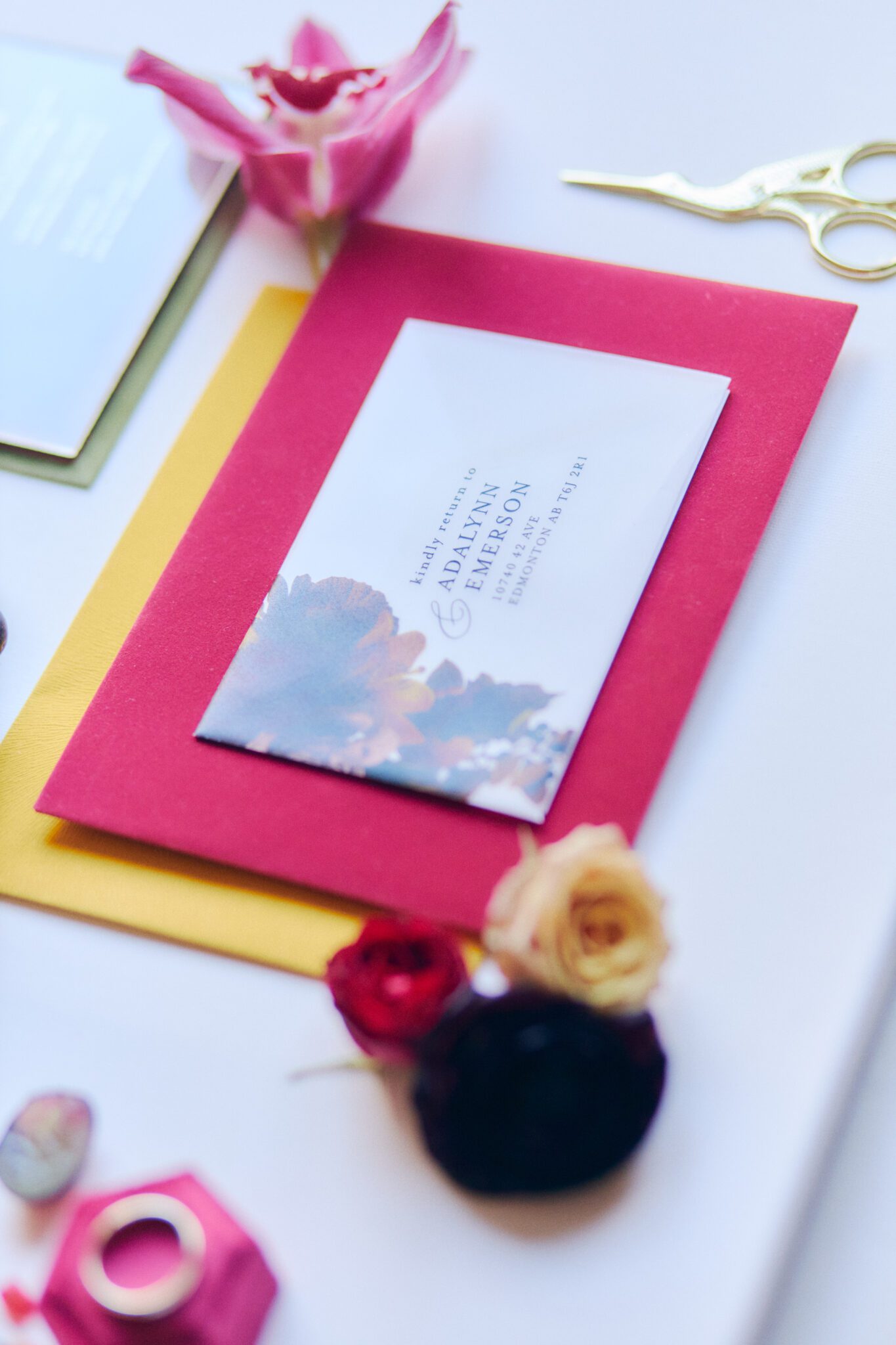 Vibrant and bold wedding inspiration. Hot pink, yellow, green and purple and wedding invitation paper suite. Hot pink velvet ring box, and gold details. 