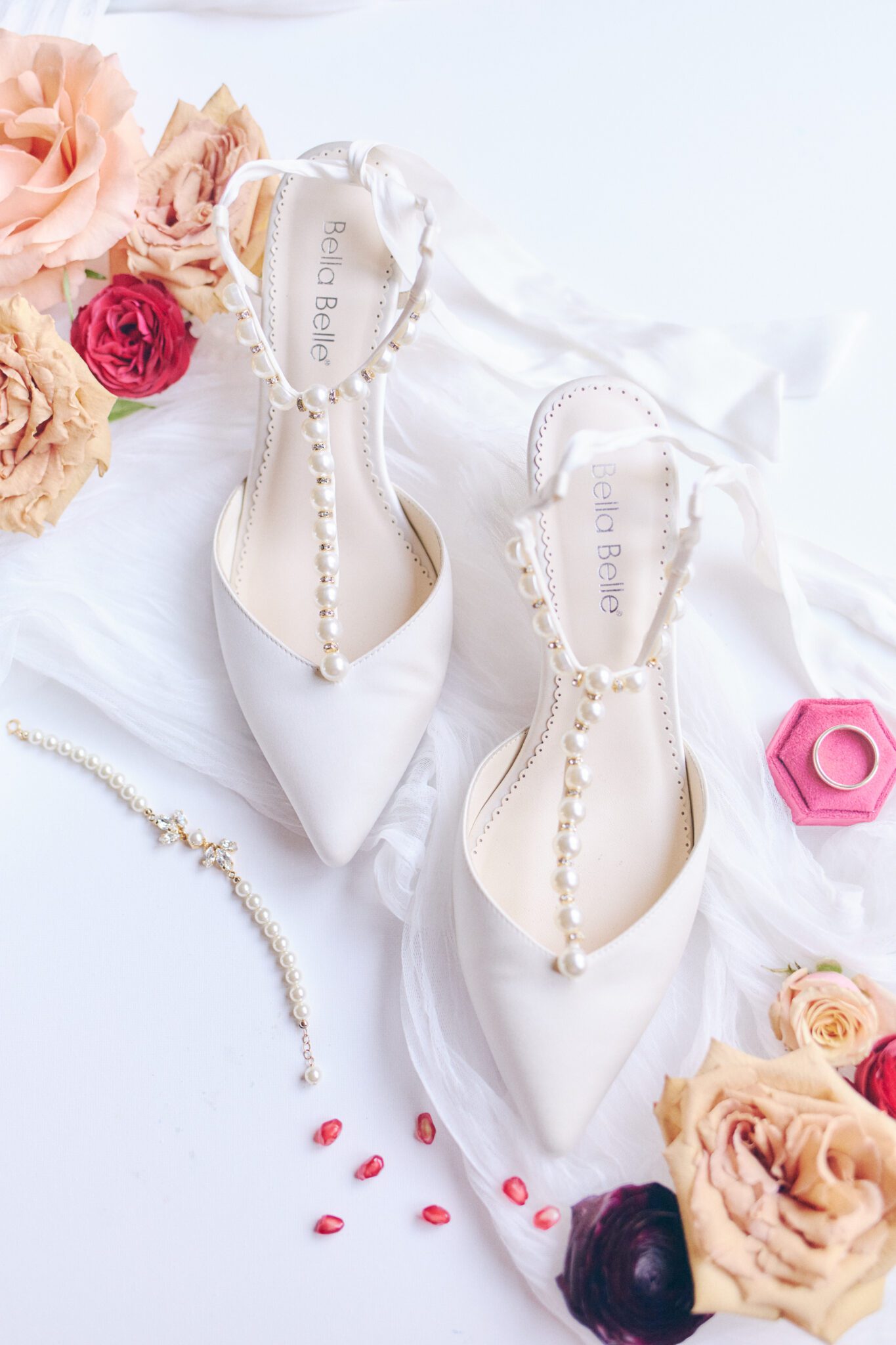 Gorgeous bridal shoes with pearl strap details by Bella Belle Shoes, decorated with bold and colourful florals. Bridal detail inspiration. 