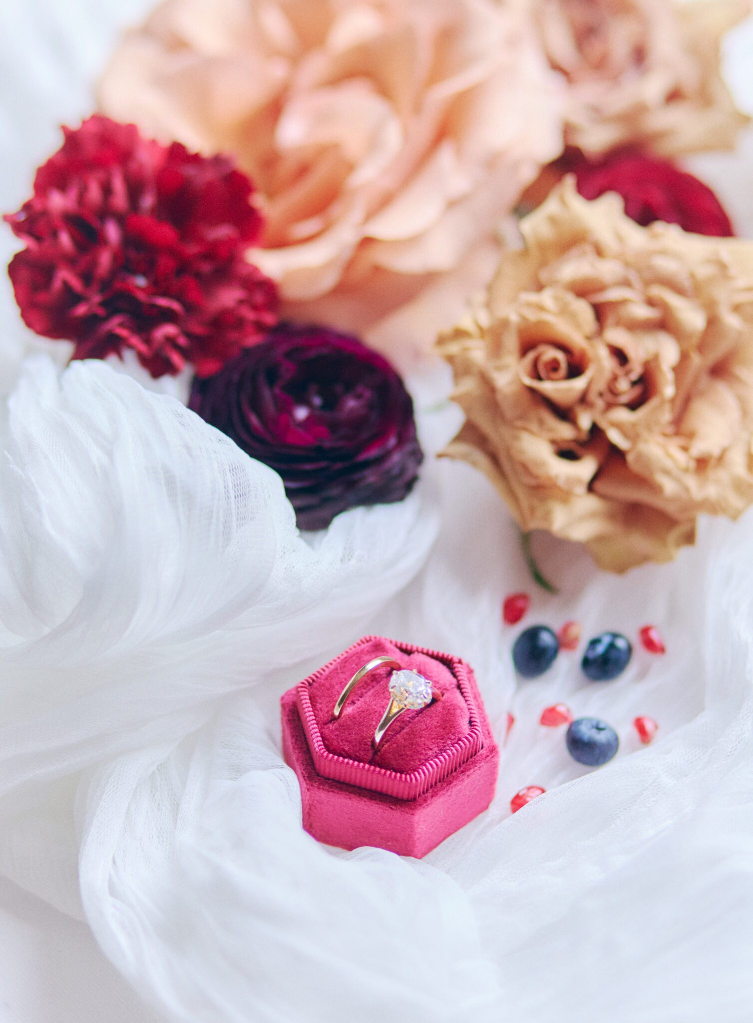 Brides wedding ring in hot pink velvet ring box, decorated with bold and colourful florals. Bridal detail inspiration. 