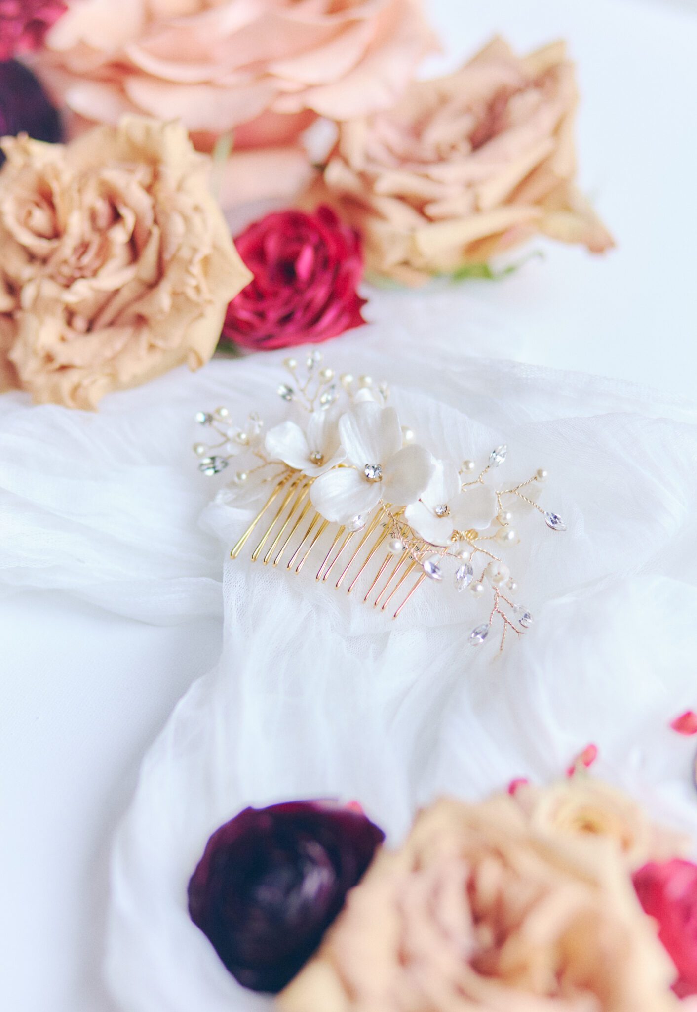 Gorgeous bridal hairpiece by Joanna Bisley Designs, decorated with bold and colourful florals. Bridal detail inspiration. 