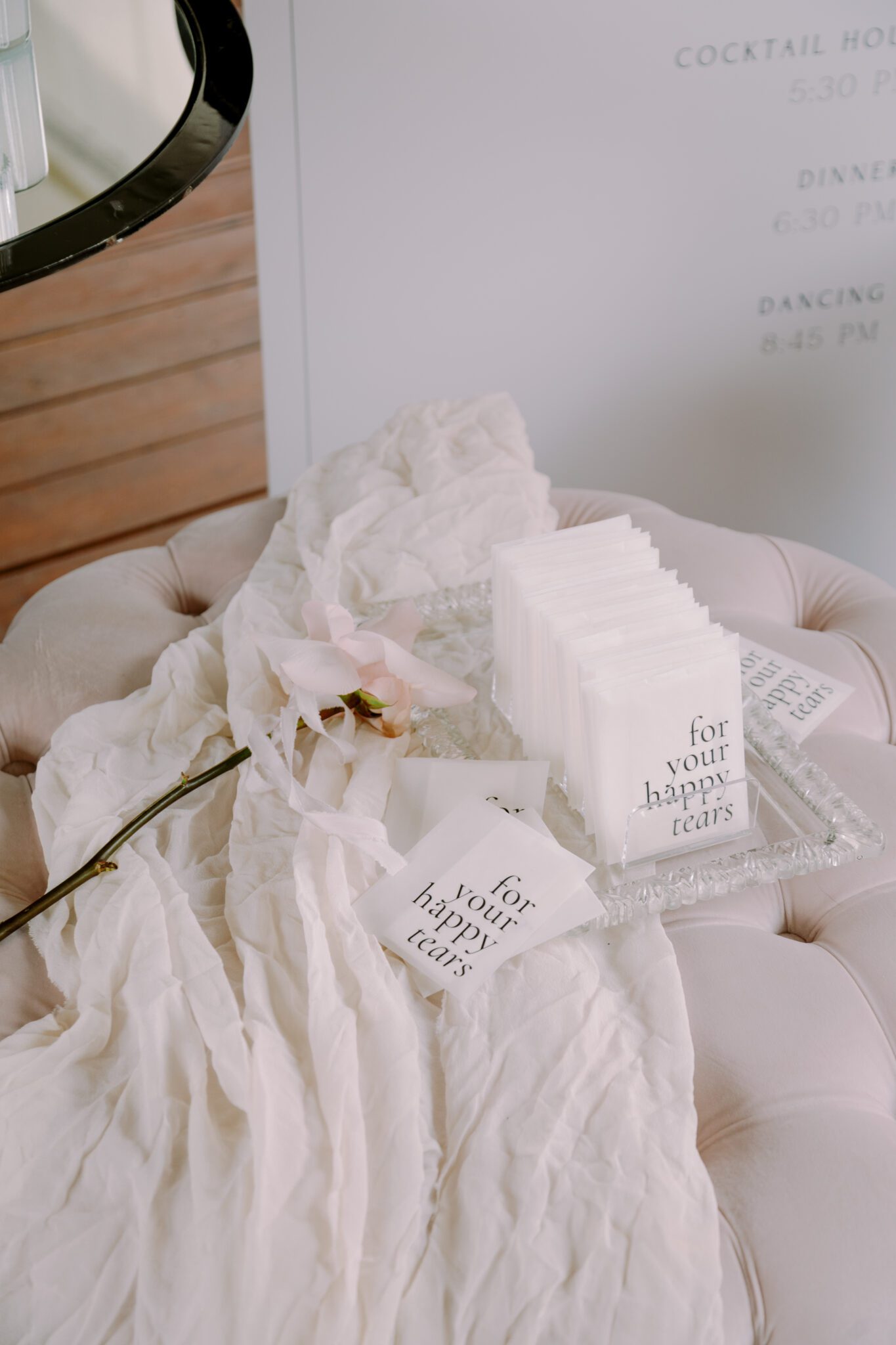 Wedding ceremony setup at Stewart Creek Golf Course in Canmore, Alberta. White, pink and black colour scheme. Mountain wedding ceremony. Guest tissues for happy tears. 