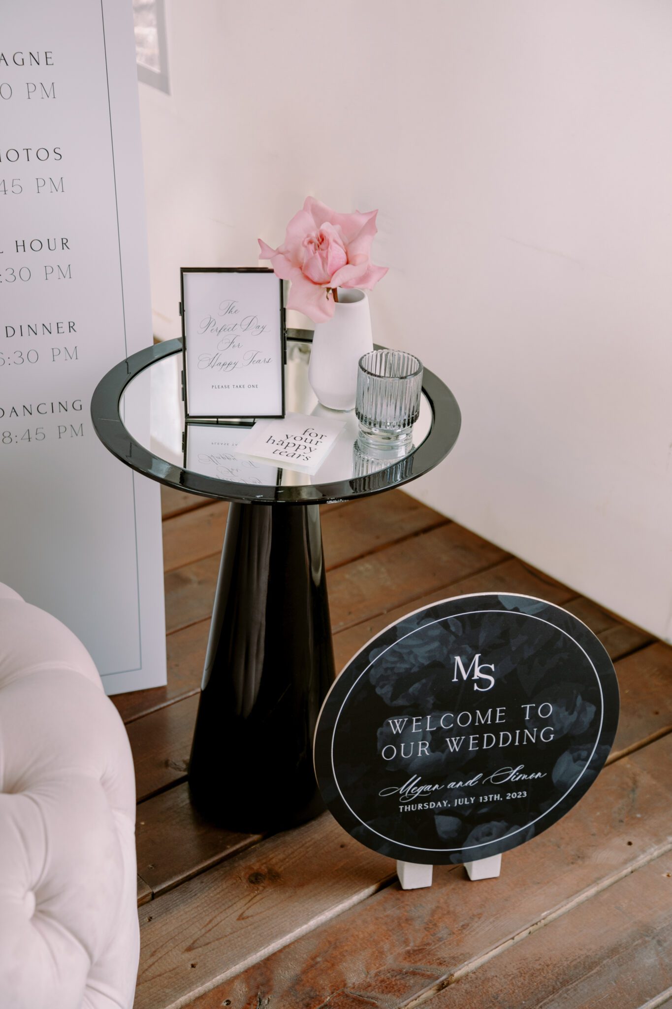 Wedding ceremony setup at Stewart Creek Golf Course in Canmore, Alberta. White, pink and black colour scheme. Mountain wedding ceremony. Wedding ceremony  welcome sign