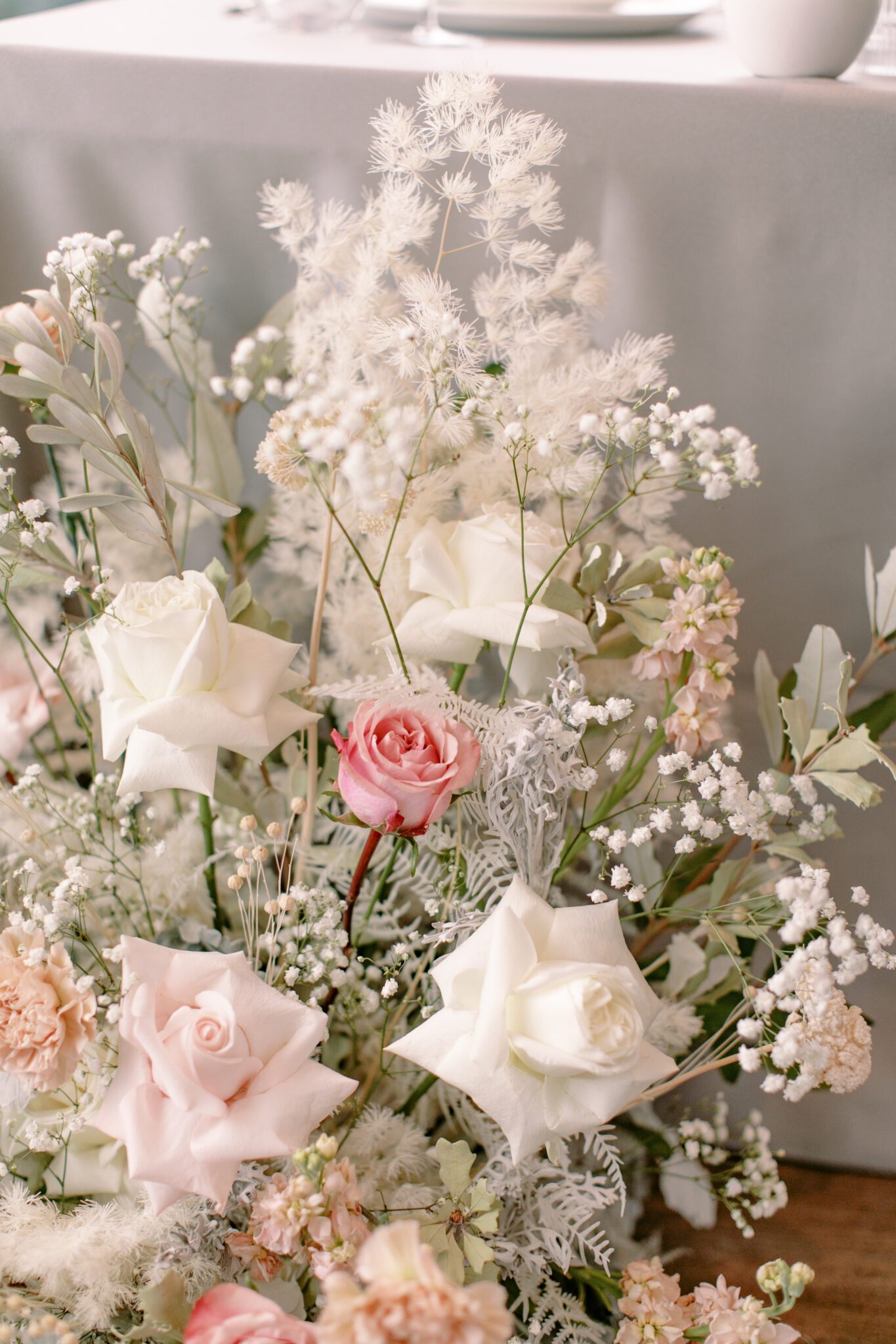 Pink, white, and peach florals at a wedding reception at The Sensory, Alberta. 