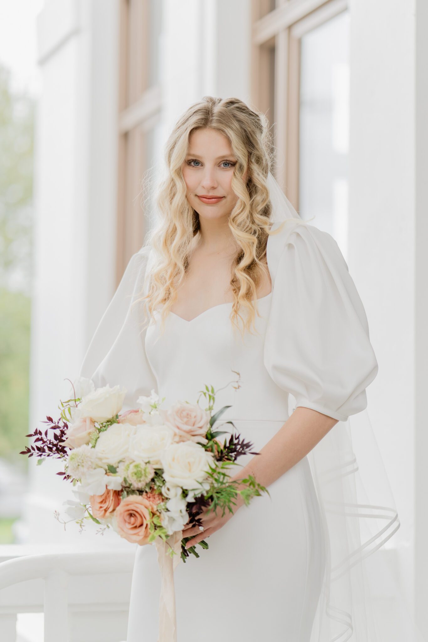 Bride during a timeless elegant wedding at Chilliwack Museum. Featuring the museum's classical architecture featuring pillars, arch windows and a grand staircase.