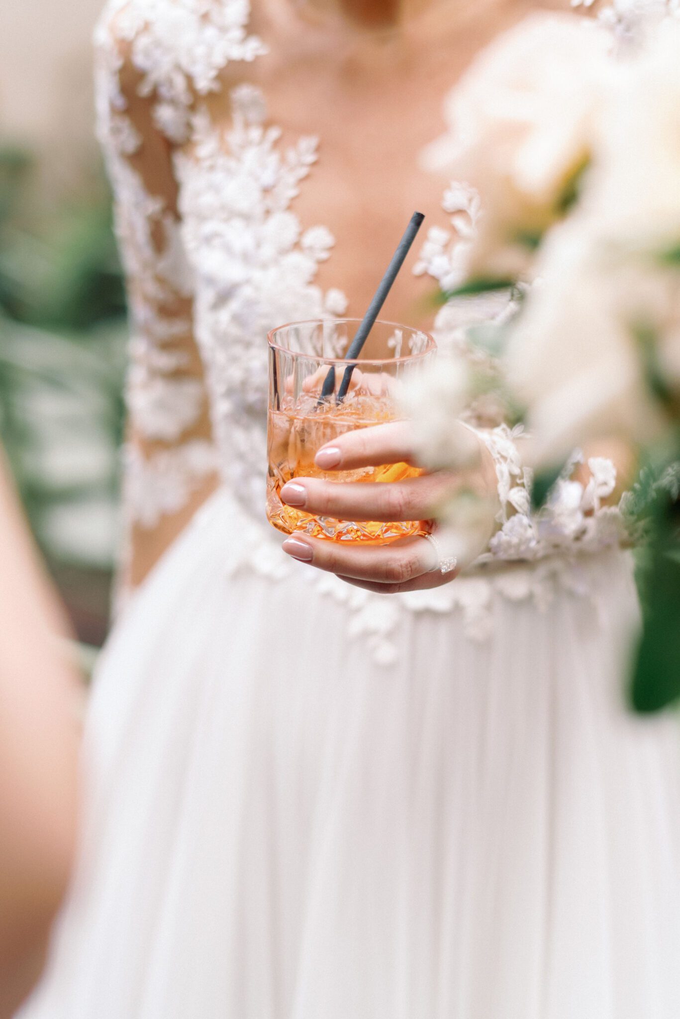 Bride holding signature cocktail at Bonterra Trattoria wedding reception in Calgary, Alberta. 