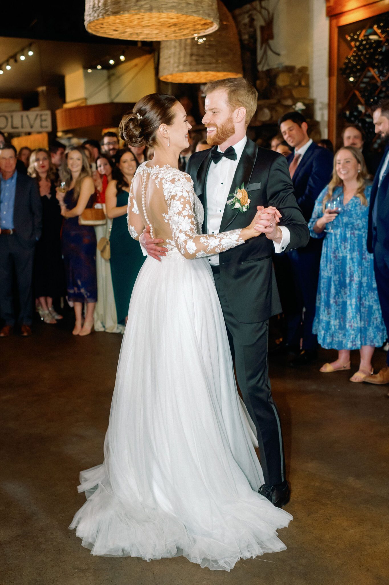 Bride and groom dance during Bonterra Trattoria wedding reception in Calgary, Alberta. 