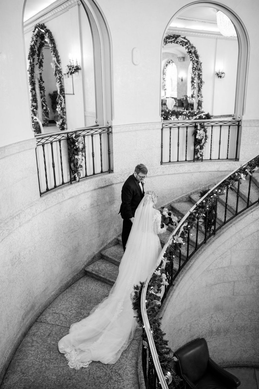 Bride and groom share a quiet moment inside the grand interior of Fairmont Banff Springs, surrounded by elegant architecture and soft candlelight. Wedding Portraits at Fairmont Banff Springs.