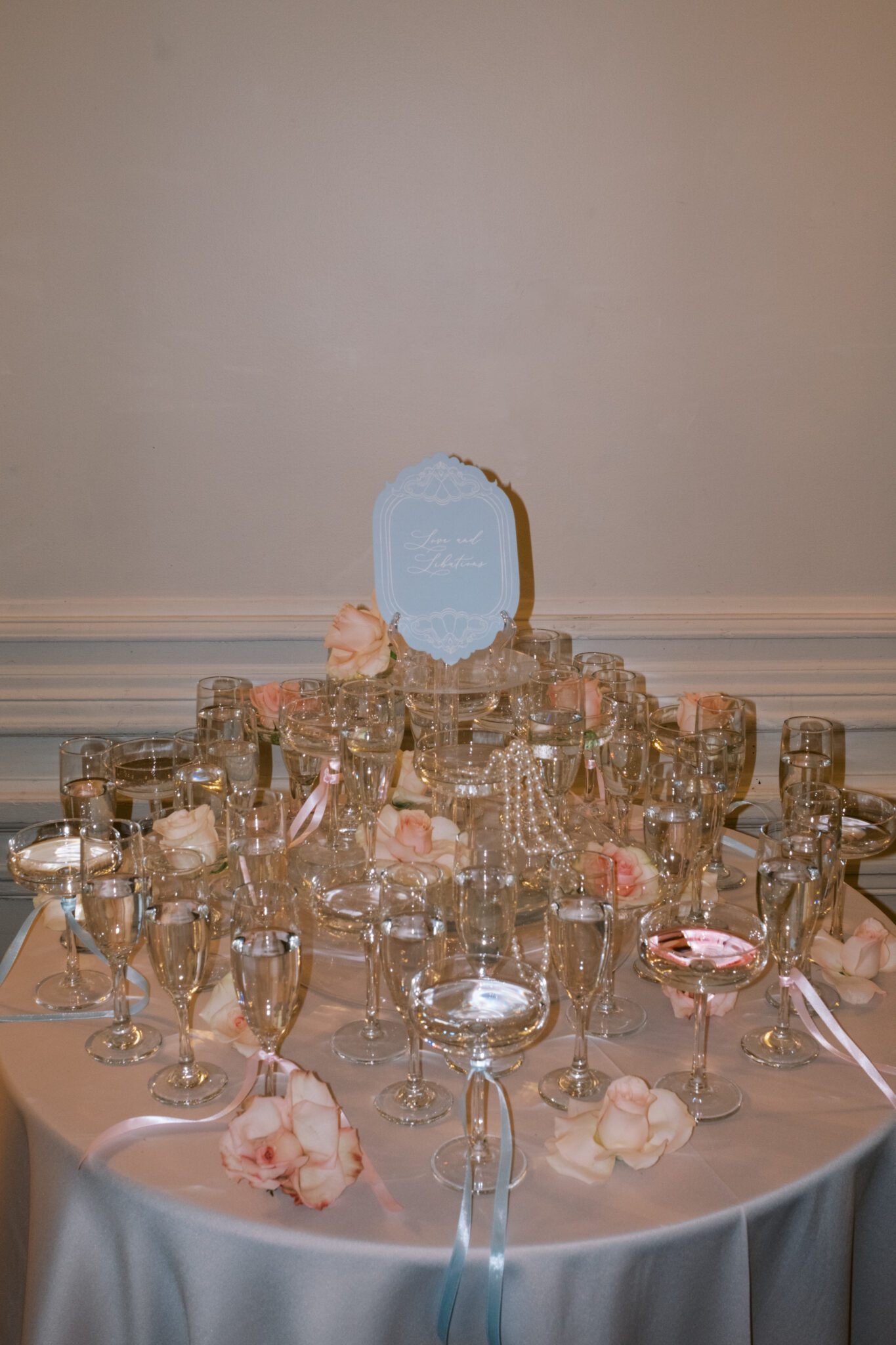 Champagne Tower with pearls and blush roses, flash photography. Whimsical ballet blush pink wedding inspiration at Fairmont Palliser Hotel. 