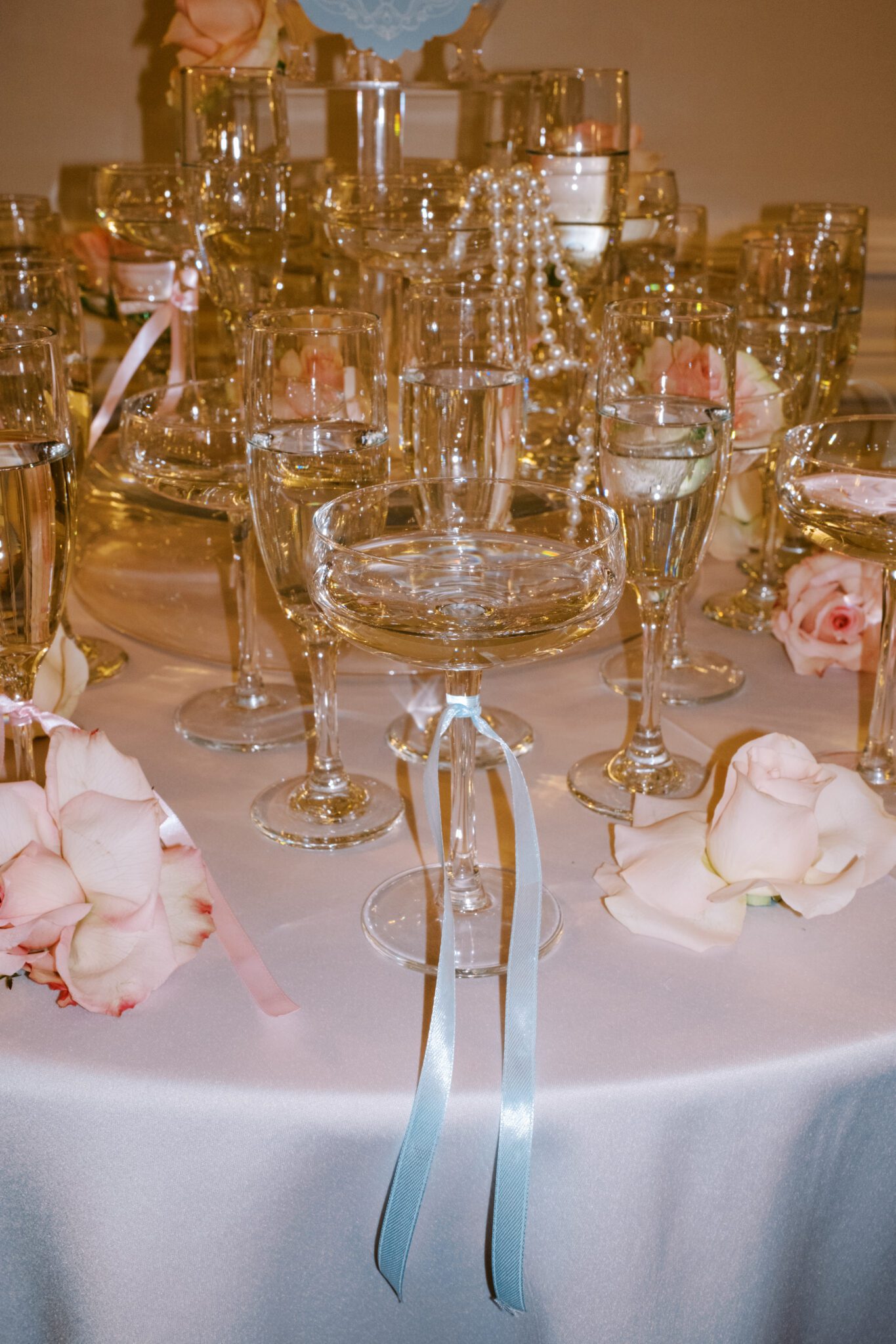 Champagne Tower with pearls and blush roses, flash photography. Whimsical ballet blush pink wedding inspiration at Fairmont Palliser Hotel. 