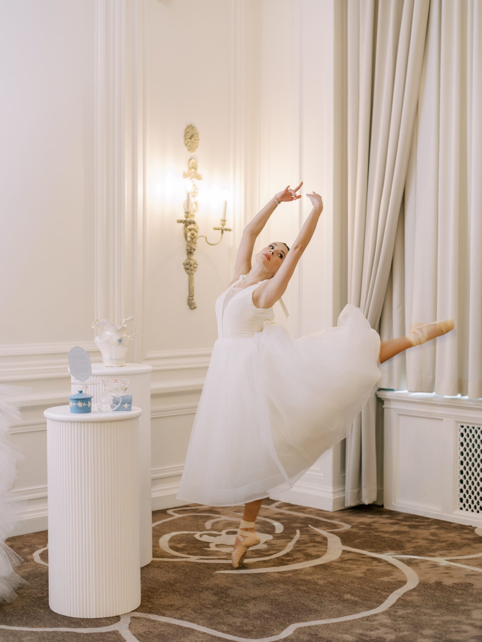 Whimsical ballet blush pink wedding inspiration at Fairmont Palliser Hotel. Ballerina bride in white tulle bridal gown, in ballerina dancing pose.