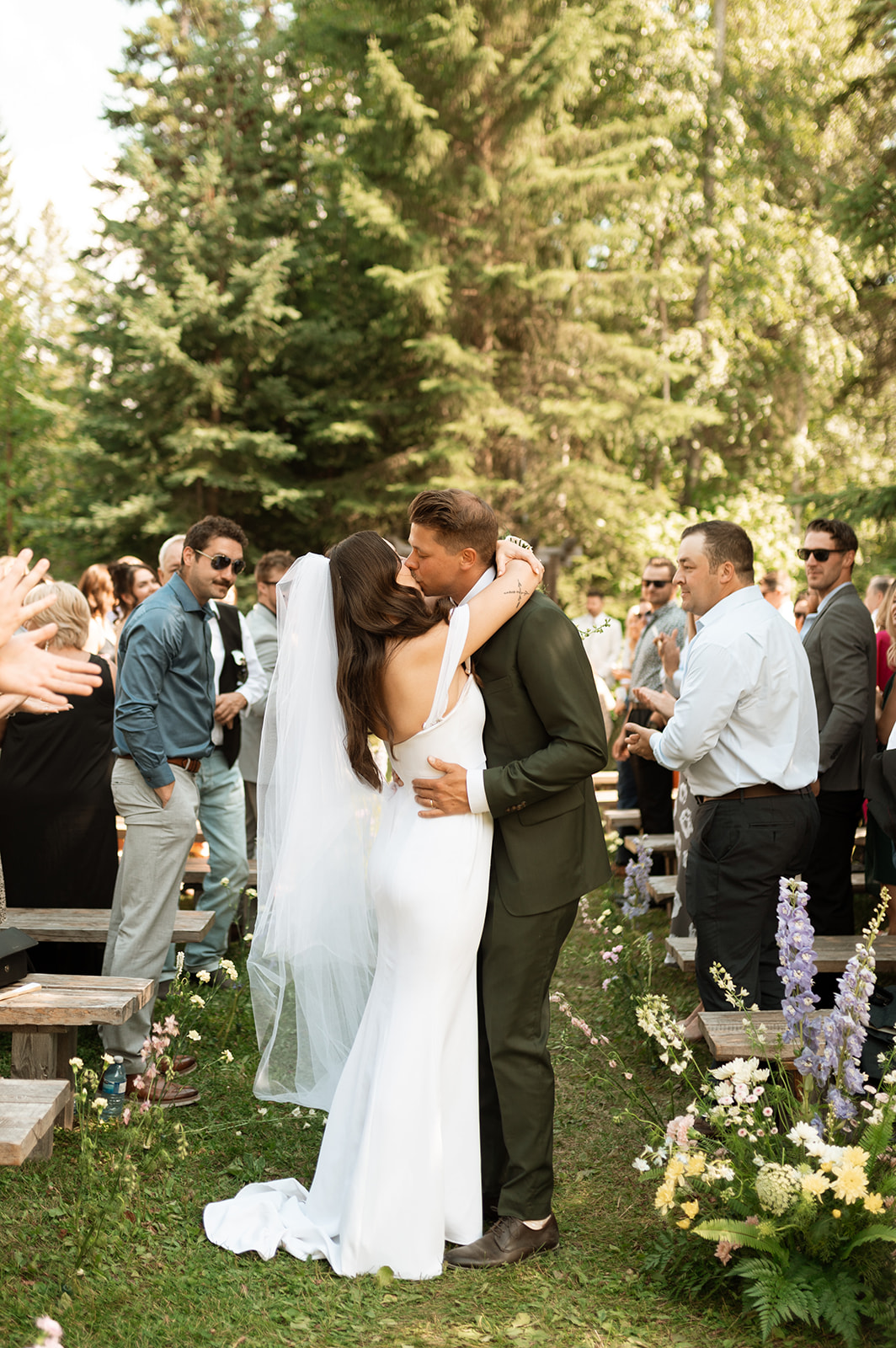 Bride and groom ceremony kiss - Wedding ceremony photography, Kootenay wedding at Hillside Lodge. & Chalets, in Golden BC