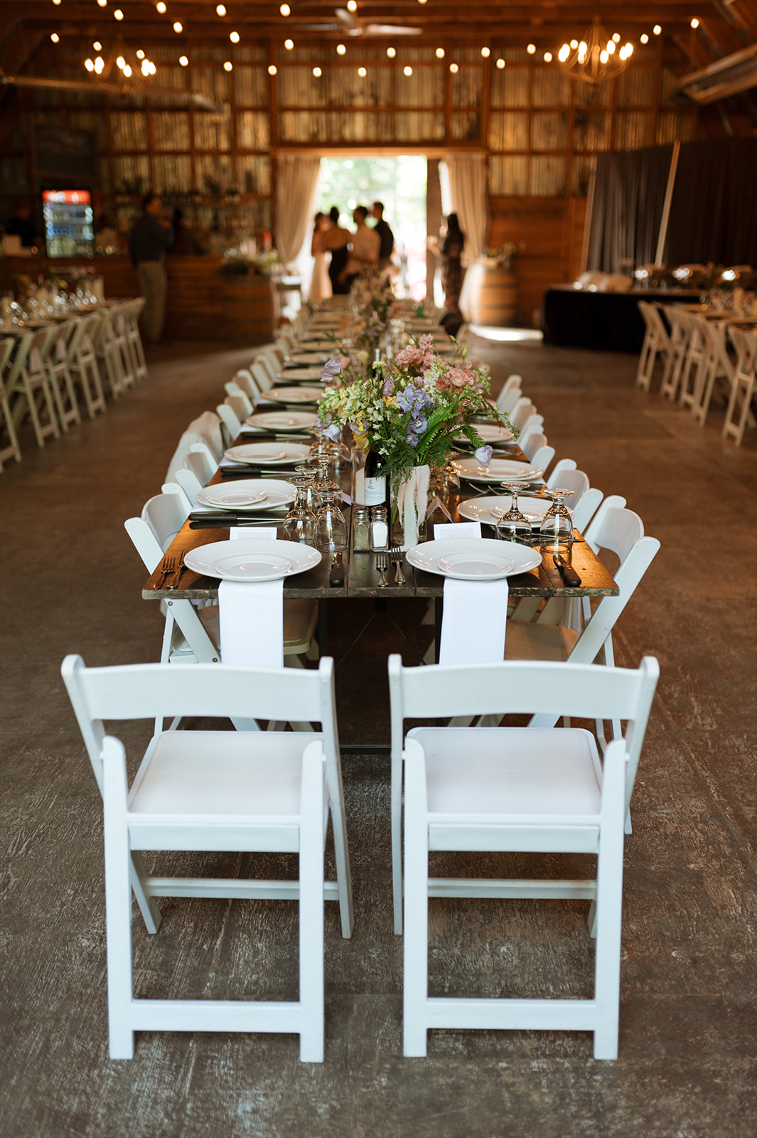 Rustic Summer wedding in Kootenay BC, Barn wedding reception tables at Hillside Lodge & Chalets in Golden BC