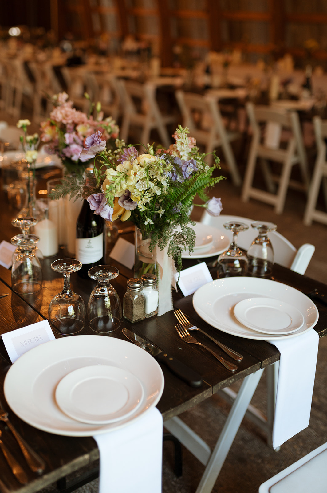 Rustic Summer wedding in Kootenay BC, Barn wedding reception tables at Hillside Lodge & Chalets in Golden BC