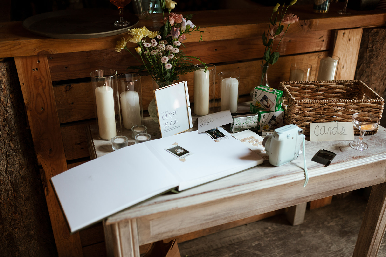 Wedding guestbook inspiration with polaroid camera - Rustic Summer wedding in Kootenay BC