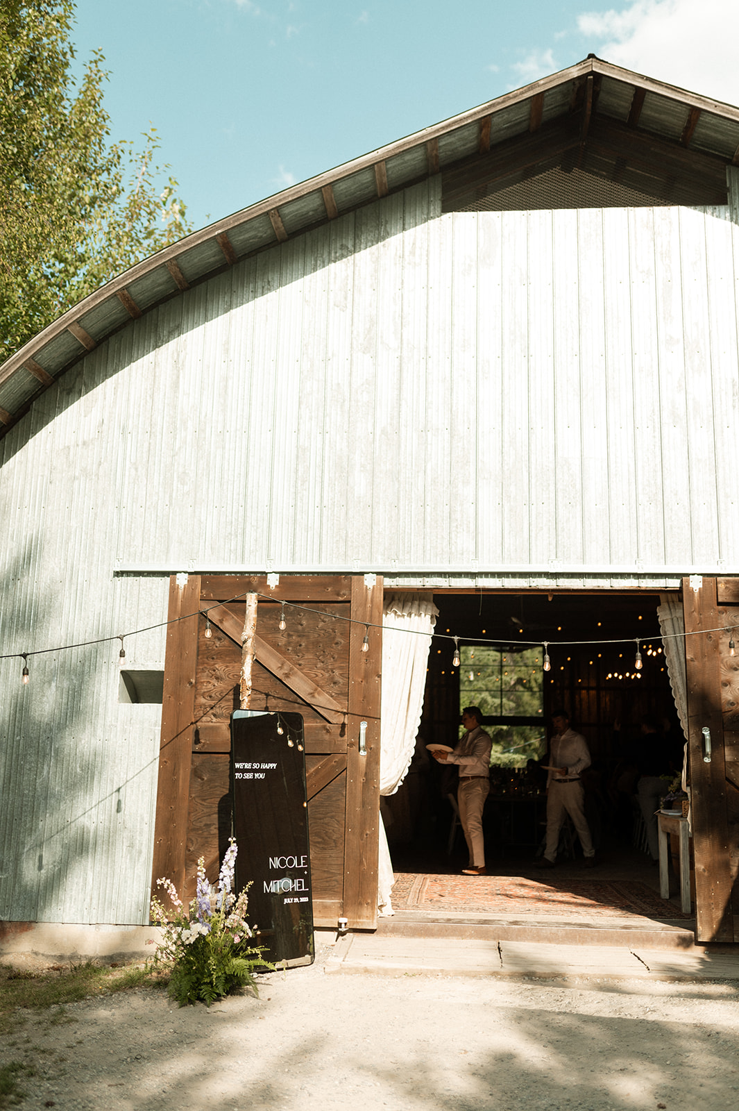 Rustic Summer wedding in Kootenay BC, Barn wedding reception tables at Hillside Lodge & Chalets in Golden BC